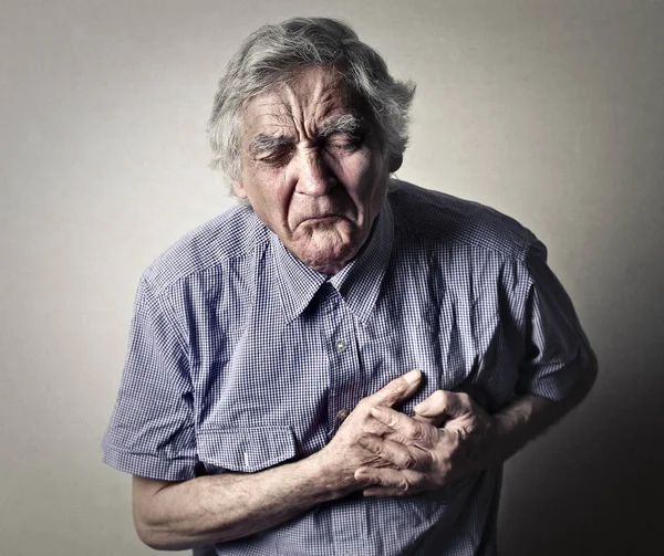 Man with heart pain — Stock Photo, Image