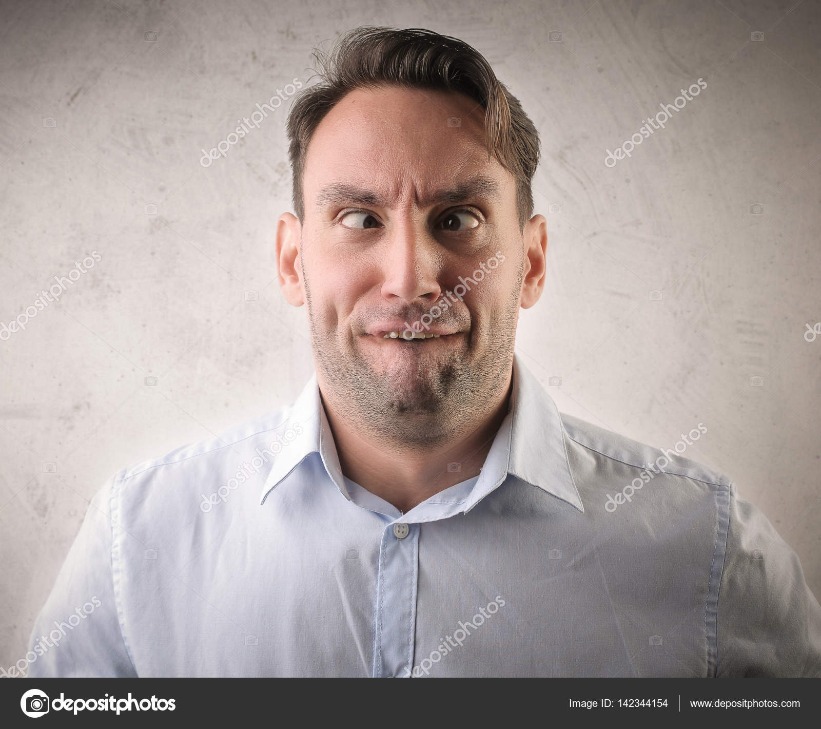 Man making stupid face — Stock Photo © olly18 #142344154