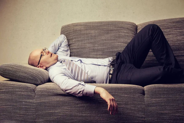 Man laying on sofa — Stock Photo, Image