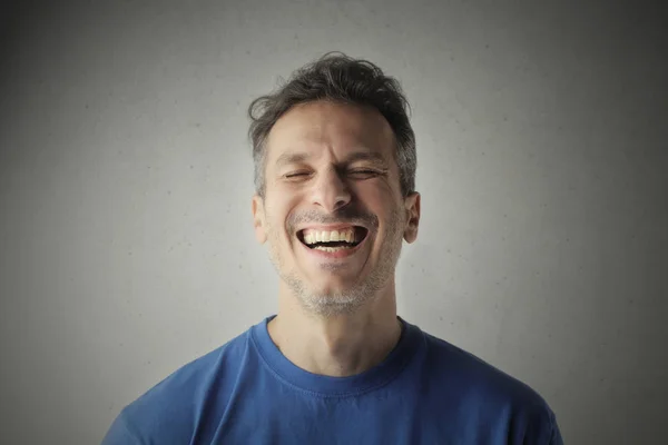 Man laughing in studio