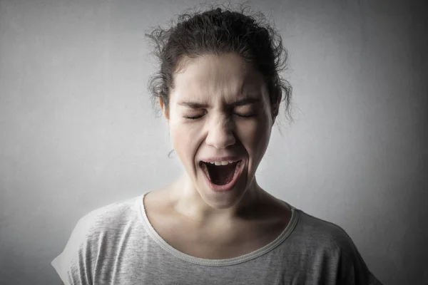 Young woman yawning — Stock Photo, Image