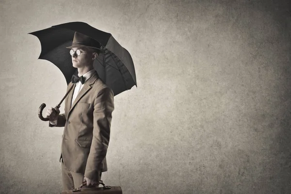 Empresário com um guarda-chuva — Fotografia de Stock