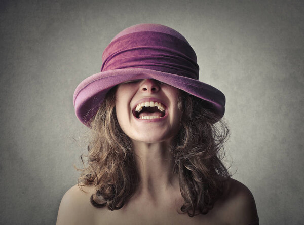 Laughing girl in hat