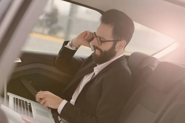 Happy businessman in car — Stock Photo, Image