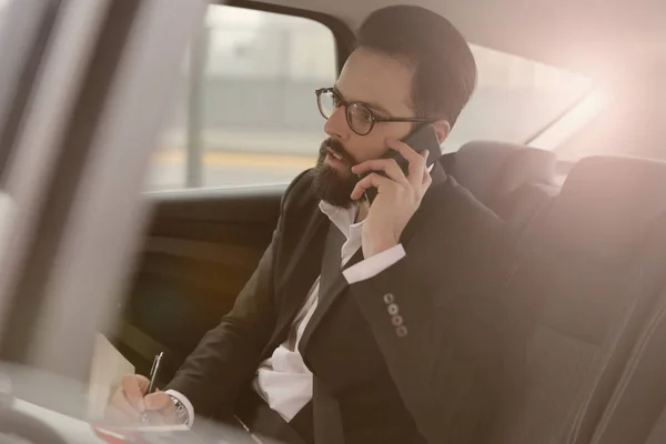 Important businessman in car — Stock Photo, Image