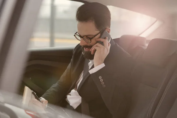 Businessman in car — Stock Photo, Image