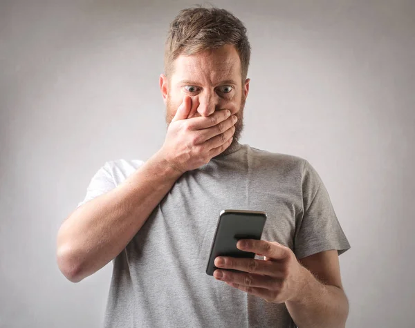 Man worried about phone — Stock Photo, Image