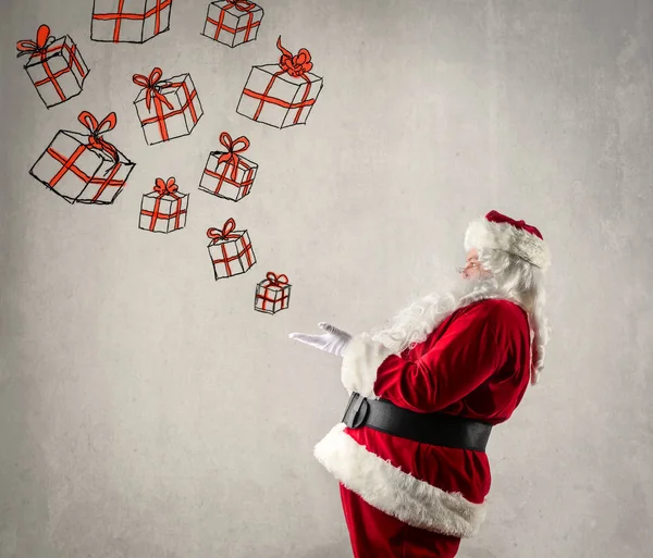 Санта с нарисованными подарками — стоковое фото