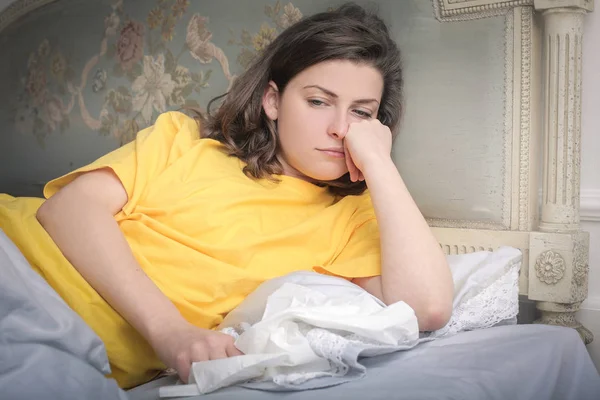 Bored woman in bed — Stock Photo, Image