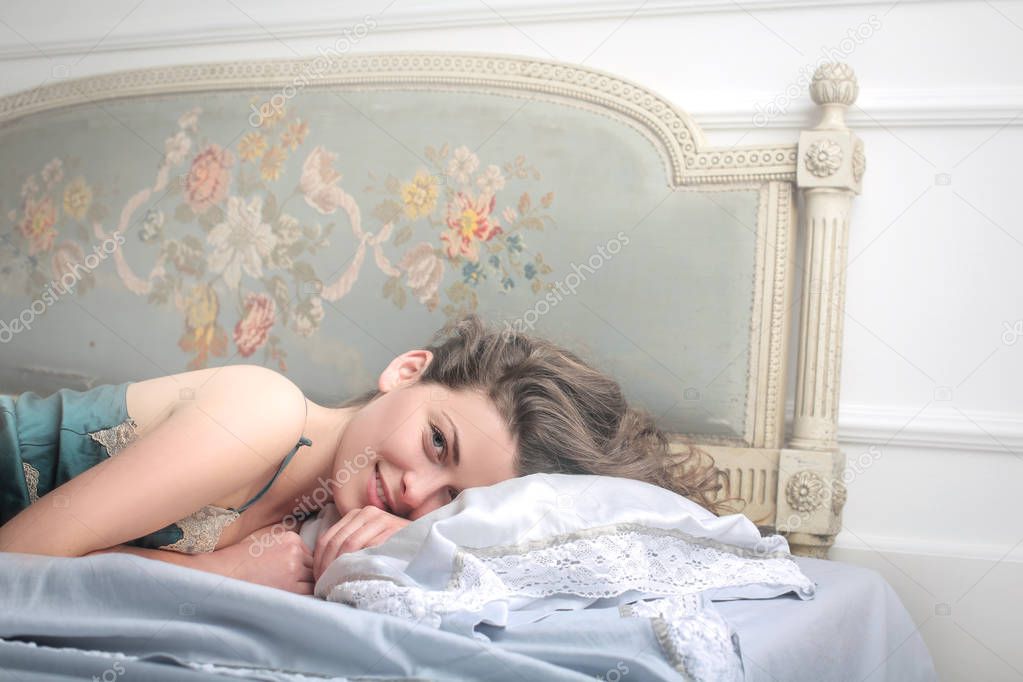 Cheeky woman in bed