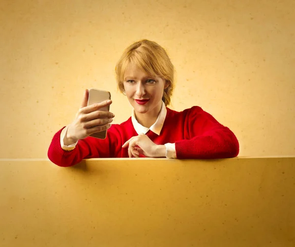 Blonde girl is making a selfie — Stock Photo, Image