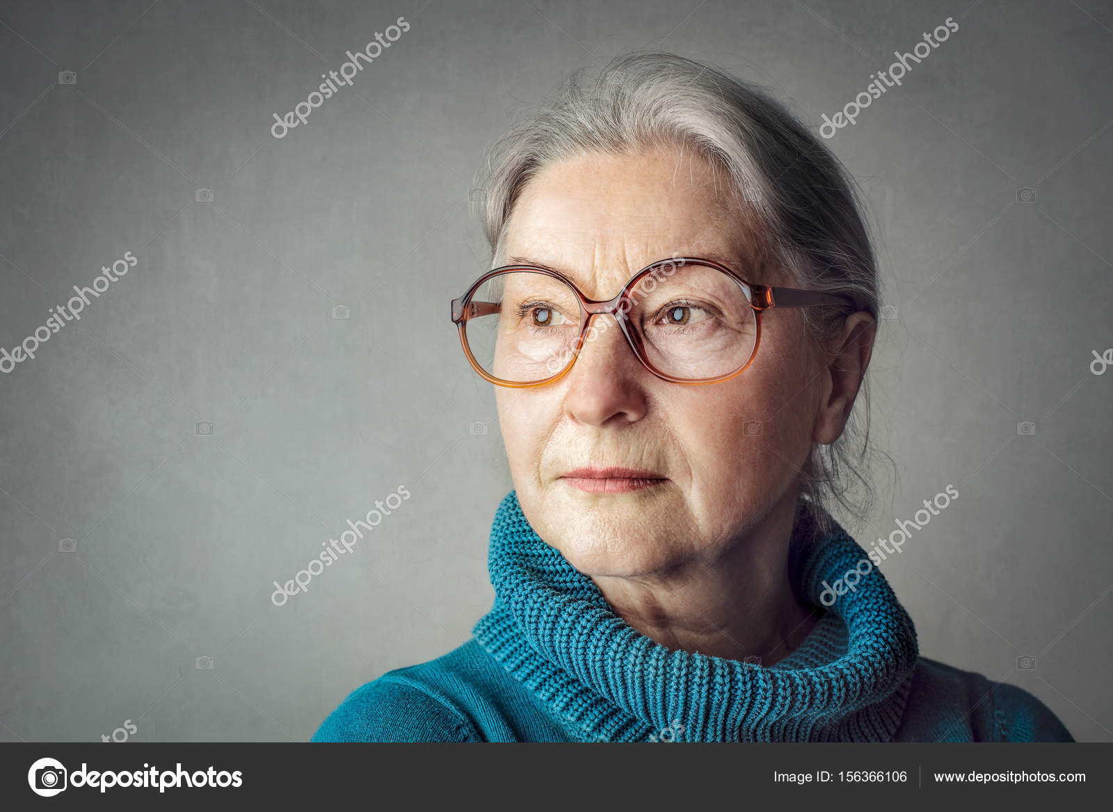 Old lady in glasses being serious Stock Photo olly18 156366106