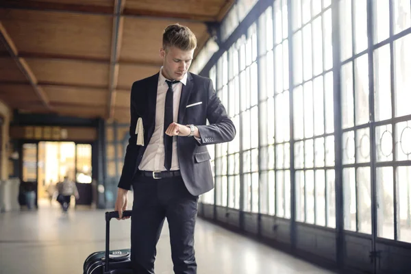 Businessman looking at his watch — Stock Photo, Image