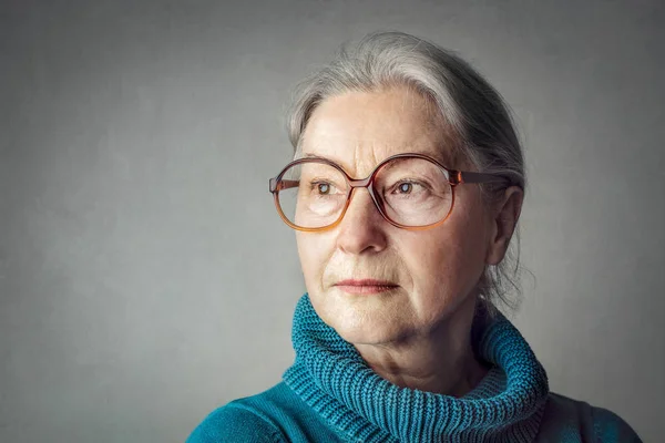 Old lady in glasses being serious — Stock Photo, Image