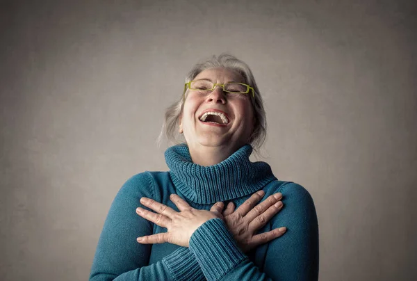 Old lady in glasses laughing inside — Stock Photo, Image