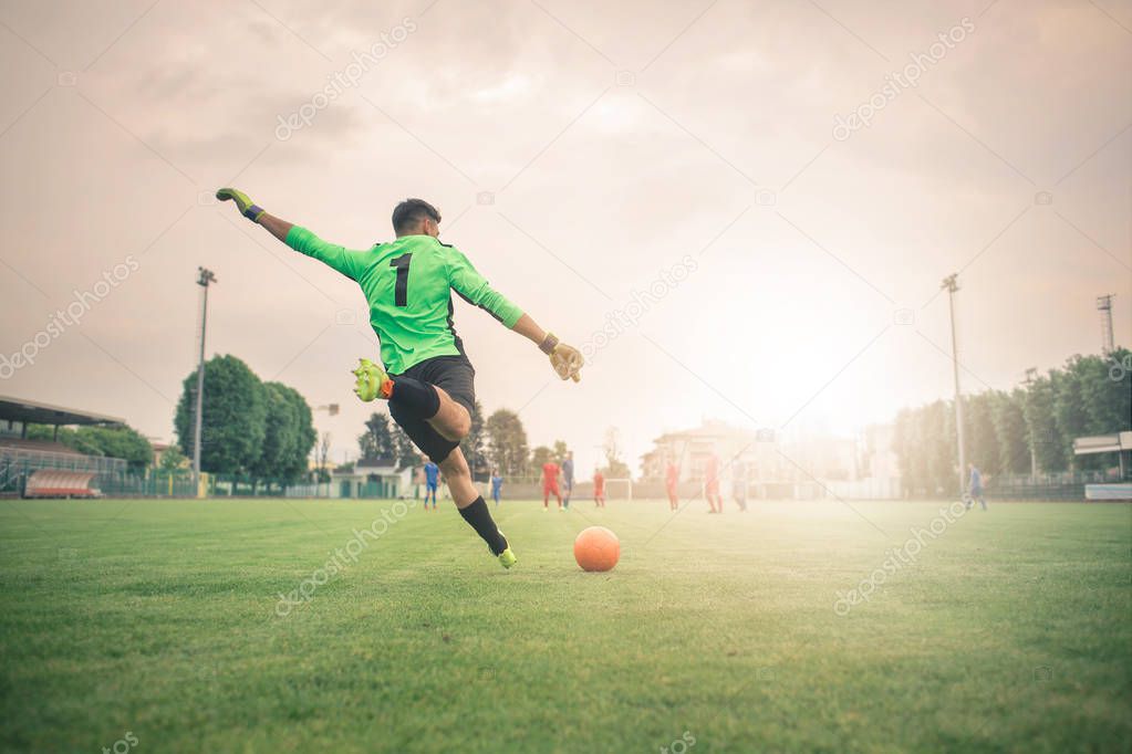 Goal keeper man kicking the ball