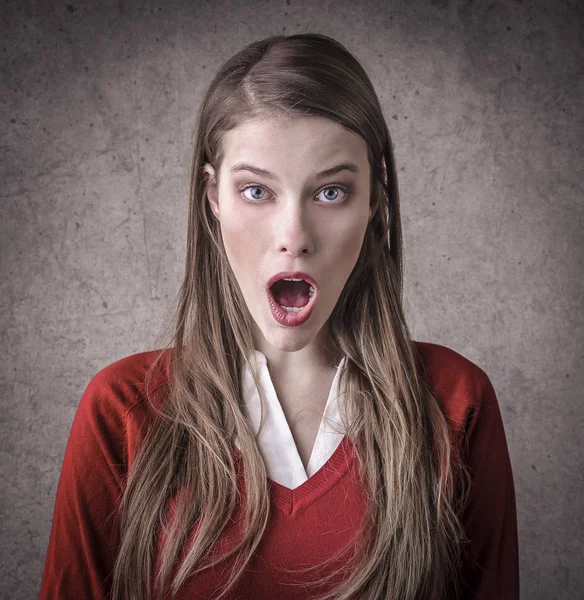 Brunette woman looking surprised inside — Stock Photo, Image