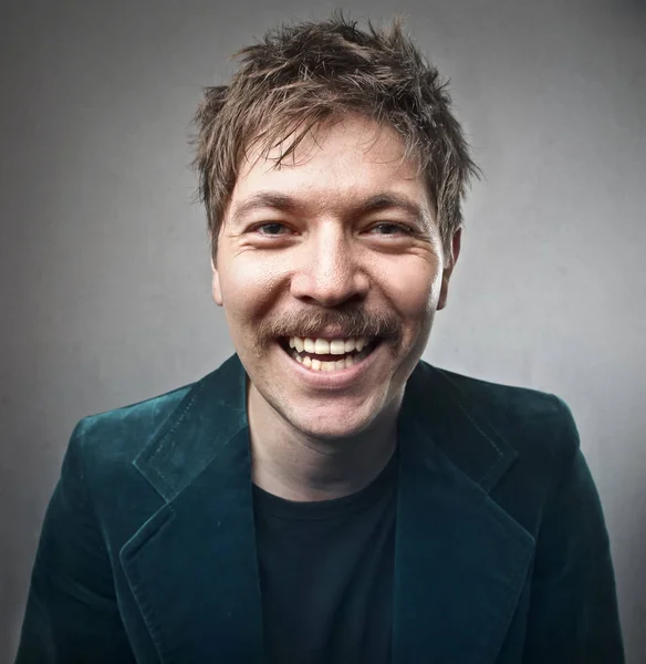 Homem elegante com bigode sorrindo dentro — Fotografia de Stock