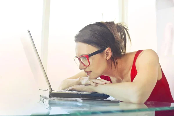 Brunette woman with laptop Stock Image