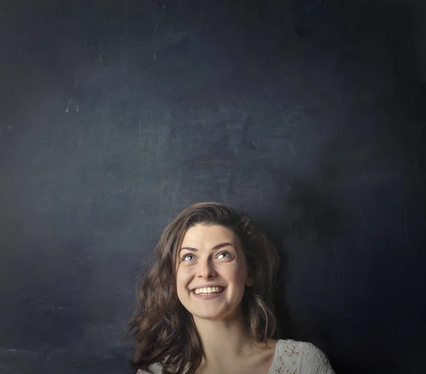 Brunette woman looking up — Stock Photo, Image