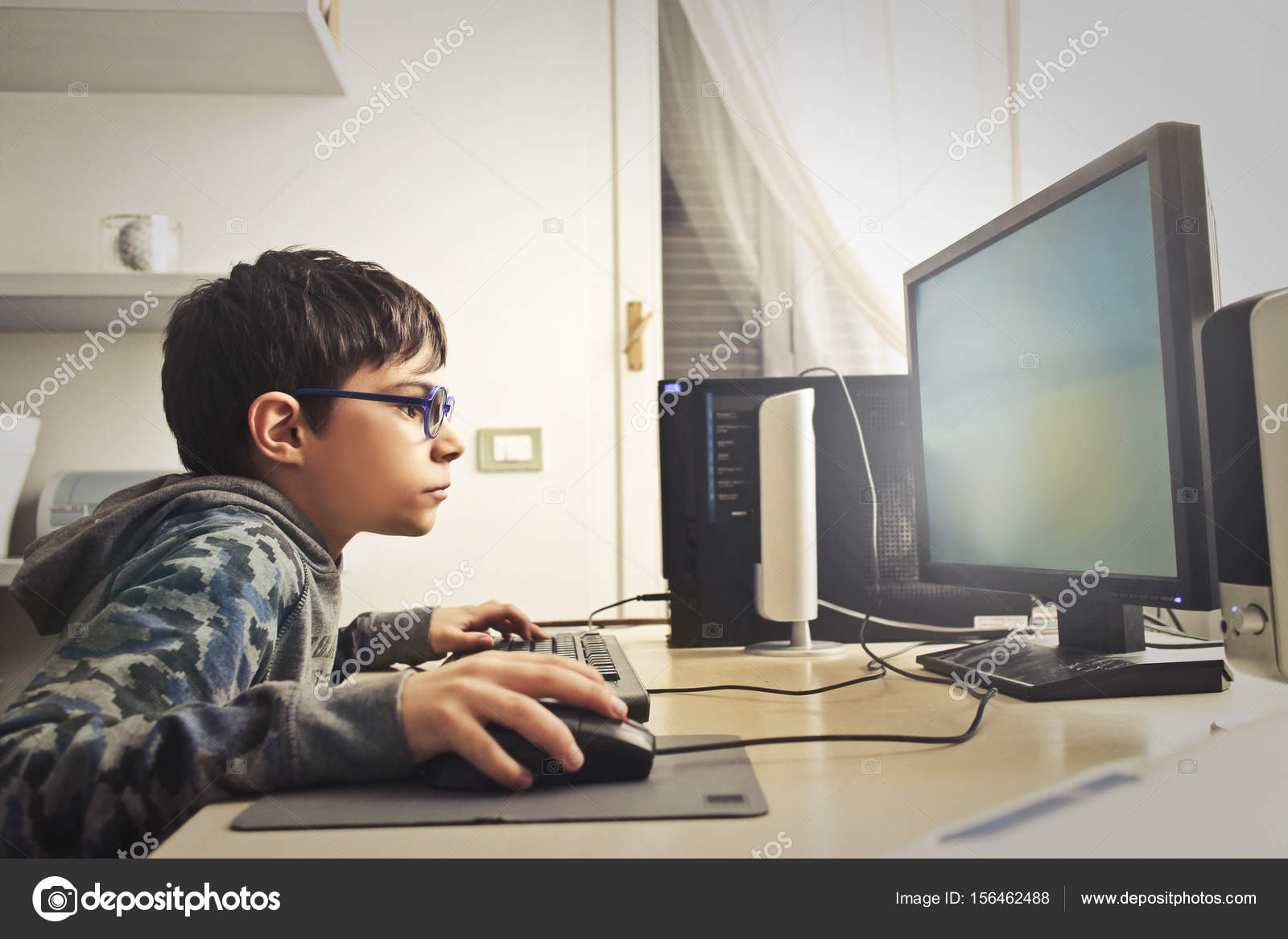 kid playing computer