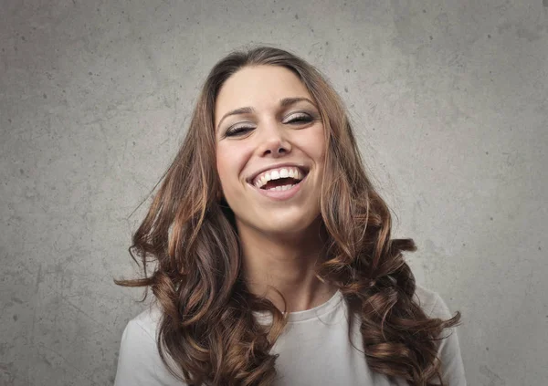 Brunette woman laughing — Stock Photo, Image