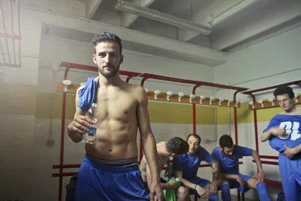 soccer player in a changing room