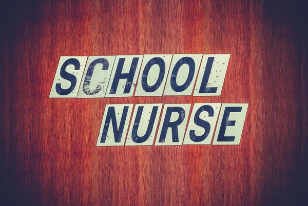 Grungy σχολική νοσοκόμα υπογράψει — Φωτογραφία Αρχείου