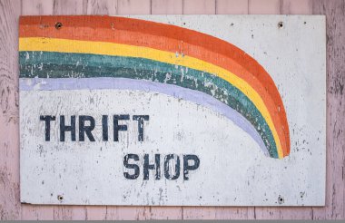 A Conceptual Recession Image Of An Old Sign For A Thrift Shop clipart