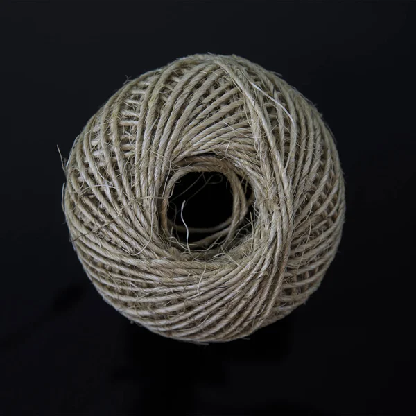 Ball of string on a black background — Stock Photo, Image