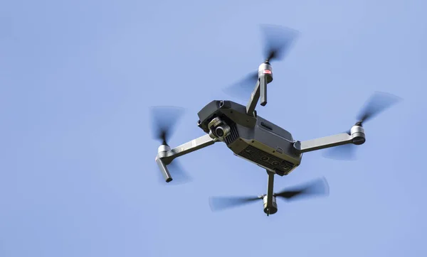 stock image DJI Mavic Pro Drone in Flight over a blue sky background