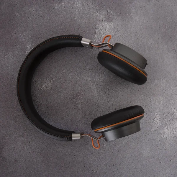 Pair Modern Black Orange Bluetooth Headphones Grey Rustict Background — Stock Photo, Image