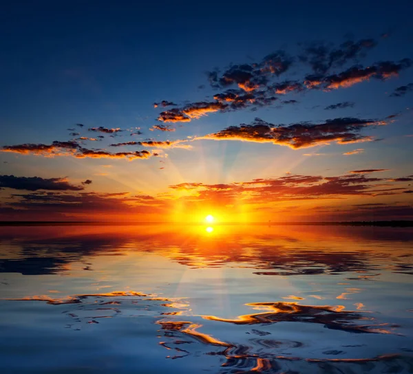 Sunset over water — Stock Photo, Image