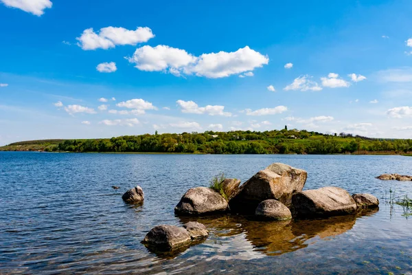 Stones in lake water — Stock Photo, Image