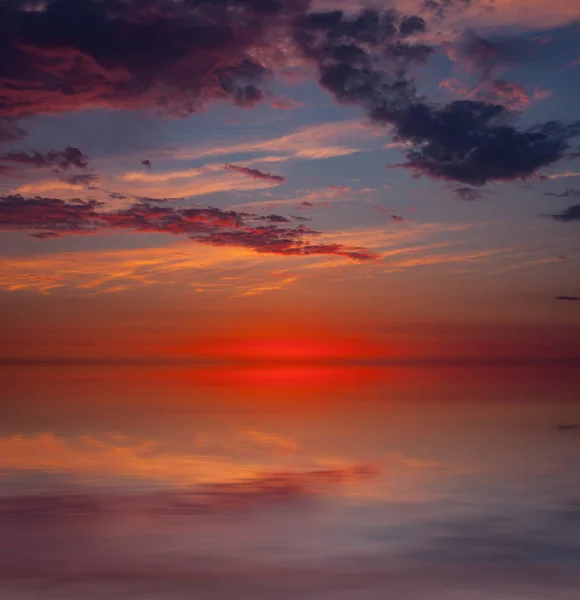 Sunset over water — Stock Photo, Image