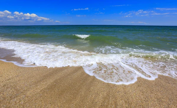 Foam on sandy sea shore — Stock Photo, Image