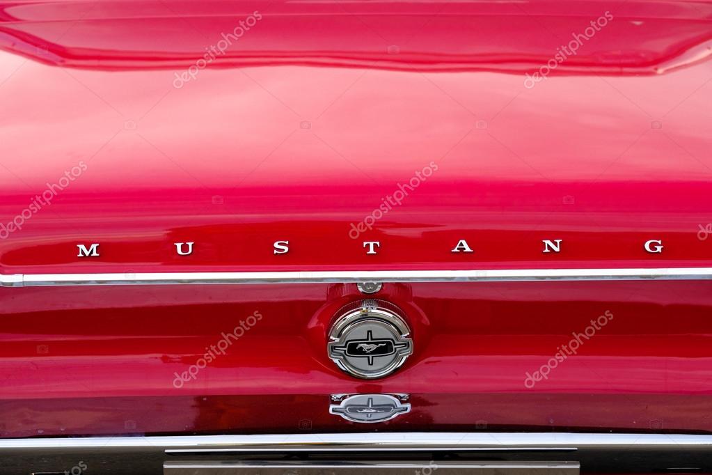 Moscow, Russia - September 10, 2016: Ford Mustang car logo on the retro car hood.