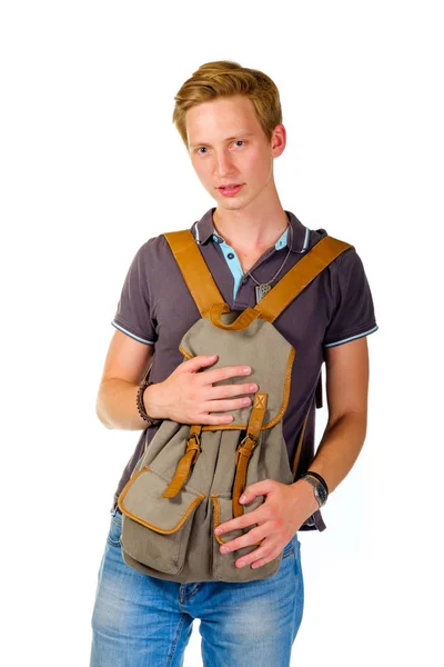 Jovem segurando uma mochila na frente , — Fotografia de Stock