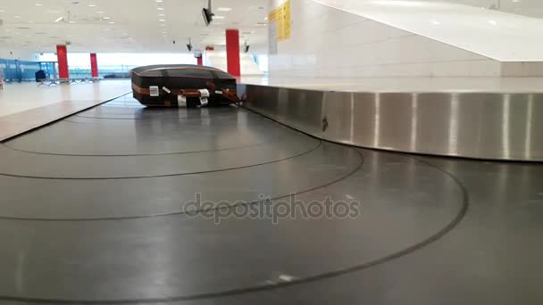 Lost suitcase moving on the conveyor in the airport — Stock Video