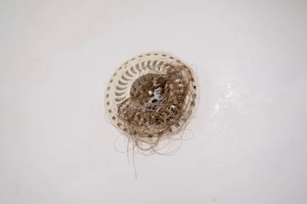 Furo de tomada de banho bloqueado com cabelo — Fotografia de Stock