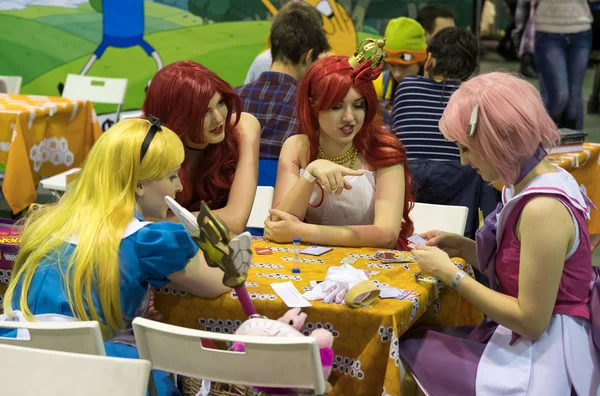 Cosplayers playing table game at the Gamefilmexpo festival — Stock Photo, Image