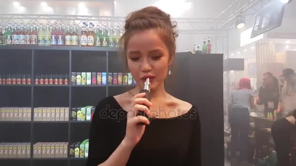 People attend Vapexpo Moscow 2016 exhibition — Stock Video