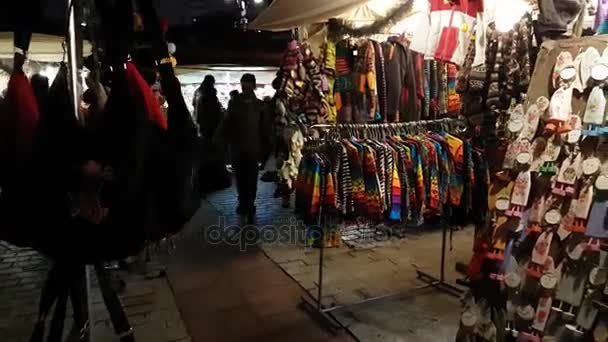 People visit Christmas market at main square in old city — Stock Video