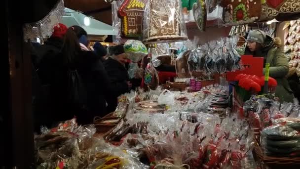 People visit Christmas market at main square in old city — Stock Video