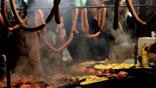 People visit Christmas market at main square in old city — Stock Video