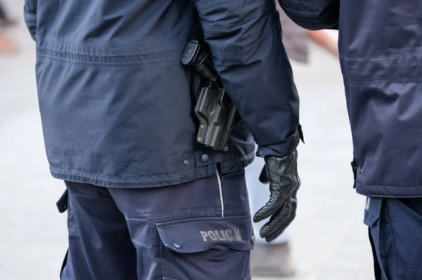 Armed with a pistol police ready to use weapons — Stock Photo, Image