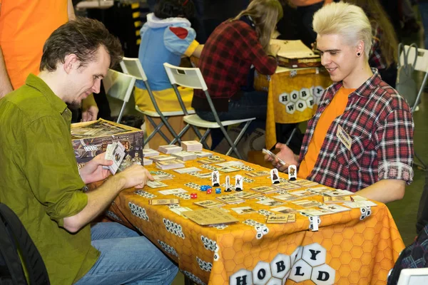 People playing table game at the Gamefilmexpo festival — Stock Photo, Image