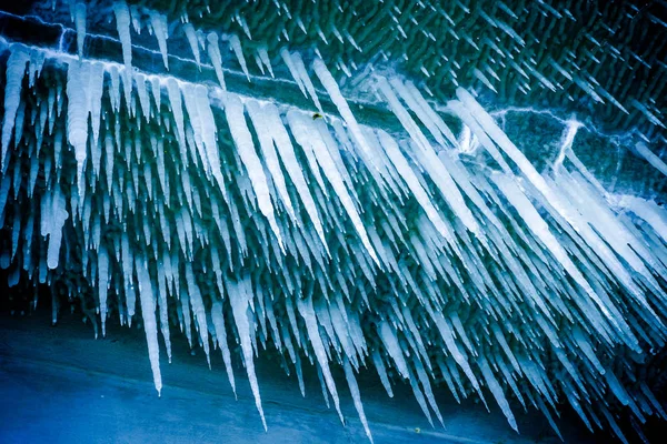 Lot of sharp and long icicles — Stock Photo, Image