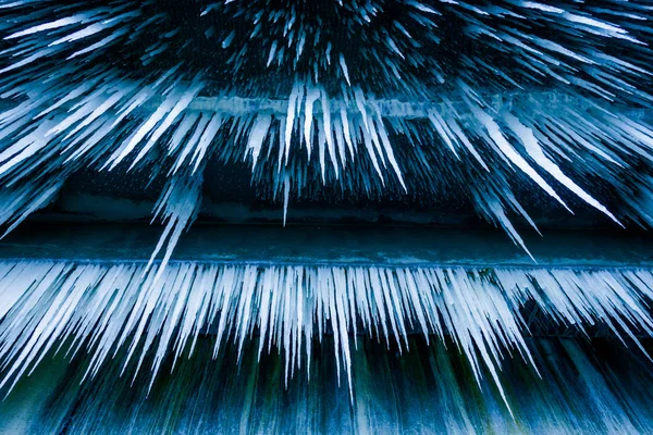 Lot of sharp and long icicles — Stock Photo, Image