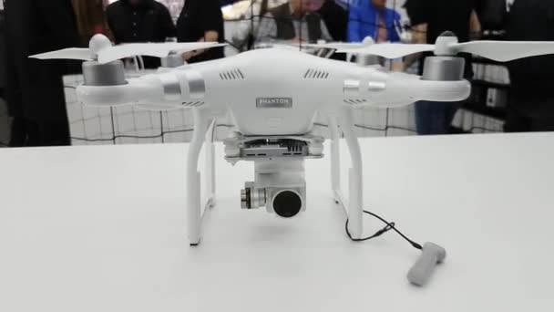 Quadrocopters for sale at the opening of DJI Store — Stock Video